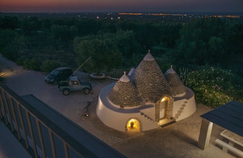 Carovigno Villa | Dionisia trulli with swimming pool, private trullo and sea view among olive tree