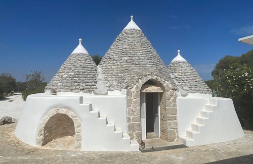 Carovigno Villa | Dionisia trulli with swimming pool, private trullo and sea view among olive tree