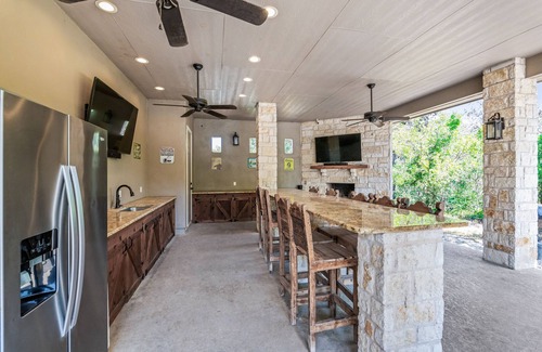 Concan House | Directly ON the Frio River, private golf cart/walking path, hot tub, swimming pool, 3 master suites