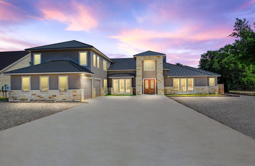 Concan House | Directly ON the Frio River, private golf cart/walking path, hot tub, swimming pool, 3 master suites