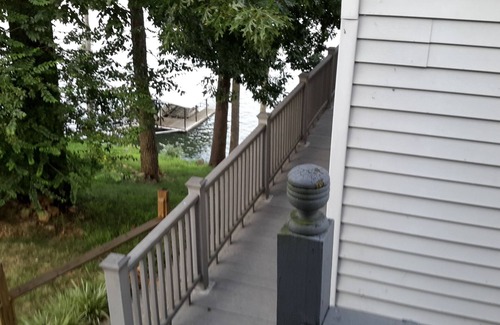 New Concord Cottage | Dock on lake and our 750 sq ft cottage home at Kentucky Lake