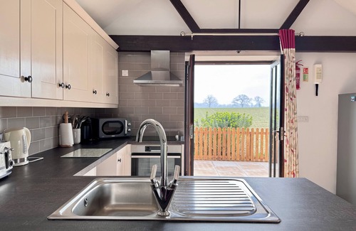 Dilham House | Dog and family friendly barn conversion with fully enclosed garden and hot tub