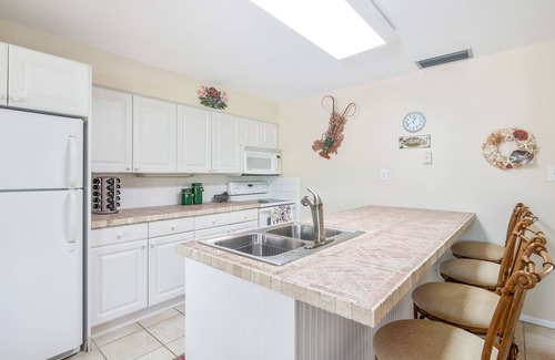 Marathon House | Dog-friendly, canal-front home with seawall dock, heated pool & gas grills
