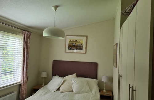 Haveringland Cabin | Dog friendly lodge In a tranquil setting with 150 acres of beautiful forest