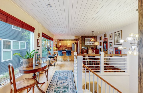 South Addition Apartment | Downtown, art-filled apartment with fireplace, balcony, & well-equipped kitchen
