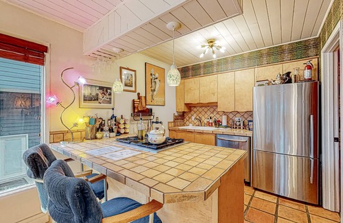 South Addition Apartment | Downtown, art-filled apartment with fireplace, balcony, & well-equipped kitchen