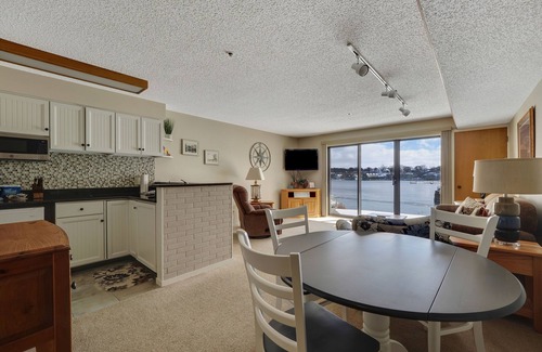 Charlevoix Condo | Edgewater Inn 115 | Sunrise Over Lake Charlevoix | Pool, Hot Tub, Sauna