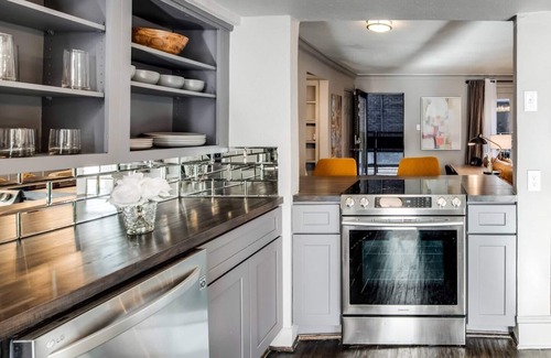 Old East Dallas Condo | Elegant 2BR condo with king bed suites, private patio, and resort-style amenities in Lakewood.