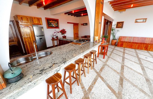 Puerto Lopez House | Elegant and Luxurious 1-bedroom with Stunning Ocean-View and Flower Gardens.