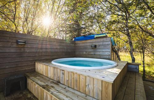 Blaskogabyggd House | Embrace Nature by the River - Hot Tub and Scenic Views