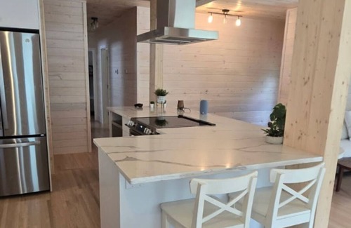 Christopher Lake Cabin | Emma Lake Sunset Bay retreat! One minute walk to the beach with large deck/yard!