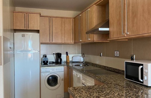 Punta del Moral Apartment | Encantador apartamento con piscina y AC primera línea de playa.