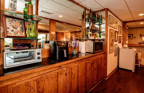 Asheville Apartment | Enjoy a beverage while viewing the Blue Ridge Mountains from the heated pool!