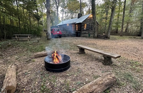 Aurora Cabin | Enjoy a cozy getaway in a rustic log cabin on Kentucky Lake. With Hottub