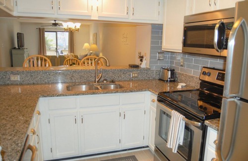 Myrtle Beach Condo | Enjoy the breeze from the screened in porch on summer nights - Summertree F2