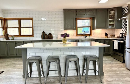 Oskaloosa House | Entertain Large Groups Here: Game Room, Pool, Patio, Fire Pit, Pool Table & More