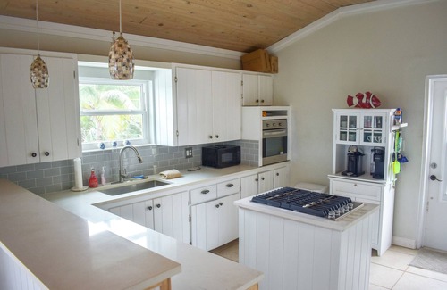 Treasure Cay House | Escape House on Green Turtle Cay is the Perfect Island Getaway w/Deep Water Dock