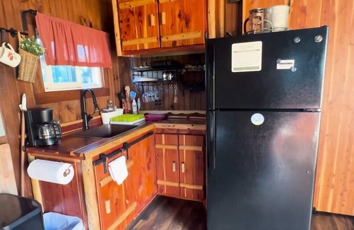 Hamptonville Cottage | Escape to a Hobbit cottage overlooking a pond with water wheel in wine country!