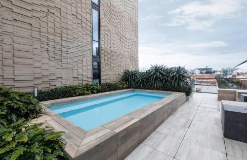 Collingwood Apartment | Evergreen Oasis - Poolside Living on Stanley Street