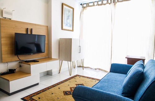 Pagedangan Apartment | Exclusive 1BR Casa De Parco Apartment By Travelio