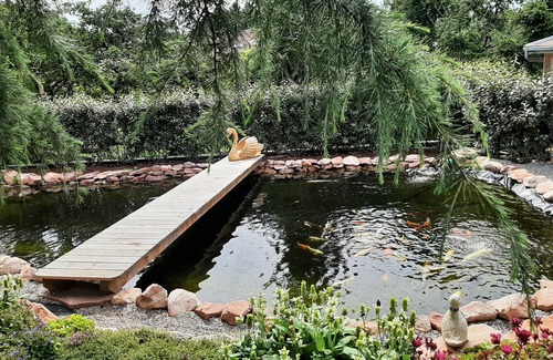 Schonbrunn House | Exclusive Holiday in a private Oasis with many plants and a pond