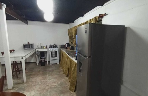 San Ignacio Apartment | Experience comfort and relaxation in our air-conditioned apartment, featuring two spacious bedrooms, a welcoming living room, a fully equipped private kitchen, and a well-appointed private bathroom. Perfect for families or groups.