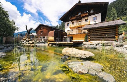 Bramberg am Wildkogel House | Farmhouse in Bramberg with Natural Pond