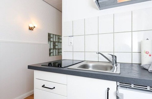 Neuharlingersiel Apartment | Ferienwohnung Dünenrose - Ferienwohnungen im Haus Waterkant in Neuharlingersiel