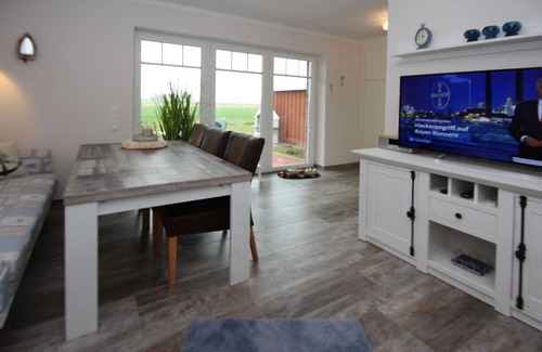 Neßmersiel Apartment | Ferienwohnung in Neßmersiel mit Garten und Feldblick