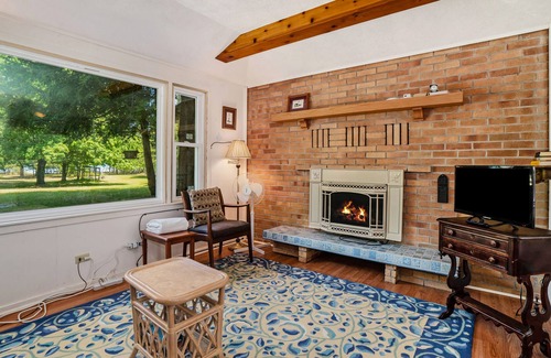 Frankfort Cottage | Flower-lined cottage with beautiful lake views, firepit access, and yard games