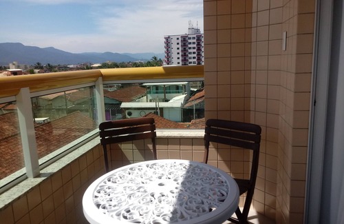 Caicara Apartment | Foot in the sand at Praia Grande