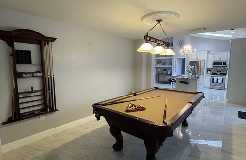 Golf and Sea Village of Apollo Beach House | Free heated pool at Apollo Beach gazebo grill pool table games