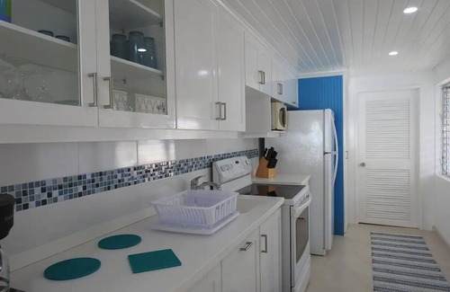 Spring Garden Apartment | Freshwater #6 is a first floor apartment that offers breathtaking views of turquoise blue ocean