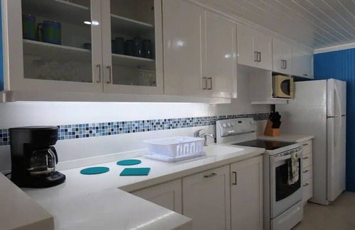 Spring Garden Apartment | Freshwater #6 is a first floor apartment that offers breathtaking views of turquoise blue ocean