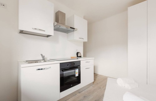 Zona Farini Apartment | Functional and modern 19 sqm studio, ideal for 2 people, located on the fourth floor of a building without lift. The accommodation is situated few steps away from the Maciachini MM, in a dynamic and well-serviced neighborhood of Milan. Perfect for single