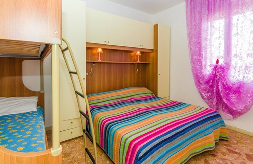 Bibione Pineda Apartment | Gabbiano tree-room flat surrounded by the green of the quite pine forest