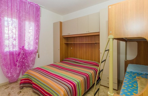 Bibione Pineda Apartment | Gabbiano tree-room flat surrounded by the green of the quite pine forest