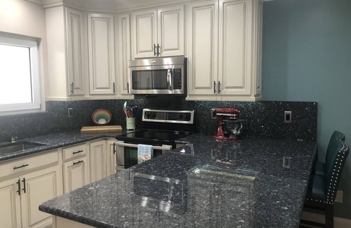 St. David's Island House | Gated Grand Harbor Townhome with beautiful views of the golf course and water