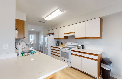 Buxton House | Gorgeous ocean-view townhouse with central AC, private W/D, patio, & pool access