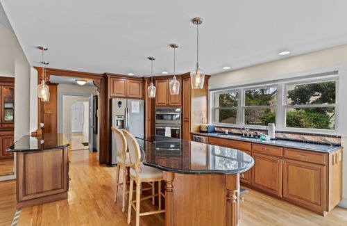 Sea Trail House | Gorgeous waterfront home with private hot tub, pool, views, deck, & fireplace