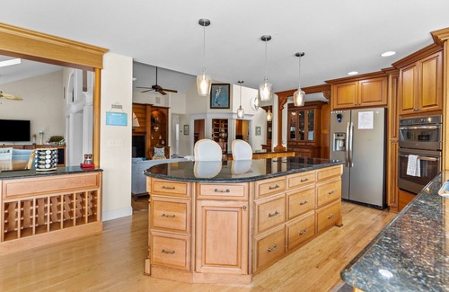 Sea Trail House | Gorgeous waterfront home with private hot tub, pool, views, deck, & fireplace