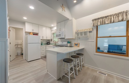 Saugatuck House | Goshorn 18 - Located in Goshorn Lake Resort - Shared pool - Lake access