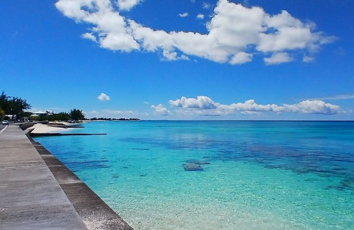 Cockburn Town House | Grand Turk Vibes - Balcony double queen room with partial ocean view!