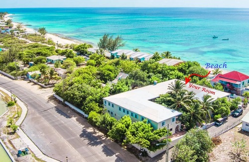Cockburn Town House | Grand Turk Vibes - Balcony double queen room with partial ocean view!