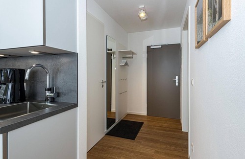 Bensersiel Apartment | Great North Sea apartment with balcony, parking, use of swimming pool & sauna -