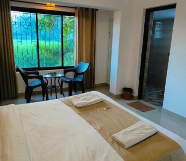 Candolim Hotel | Green Field View
