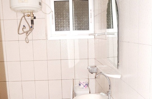 Kribi Apartment | Ground floor apartment 1 family room for 4