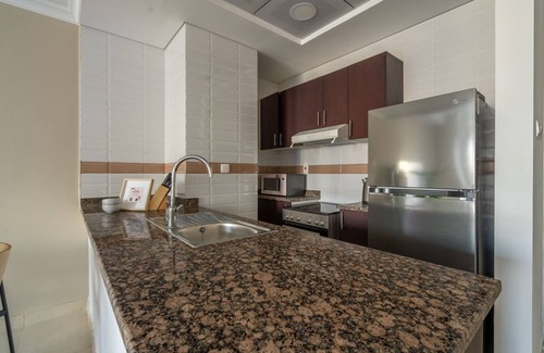 Downtown Dubai Apartment | GuestReady - A break in the clouds at Court Tower