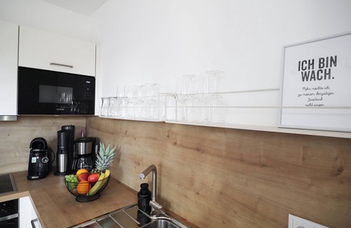 Tossens Apartment | HimmelFrei - Holiday apartment with water view. Sauna. Two roof terraces.