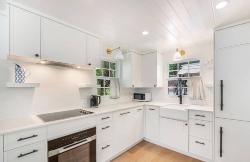 West Bay Cottage | Historic Boggy Sand Wood Cottage with Pool & Private Seven Mile Beach Access